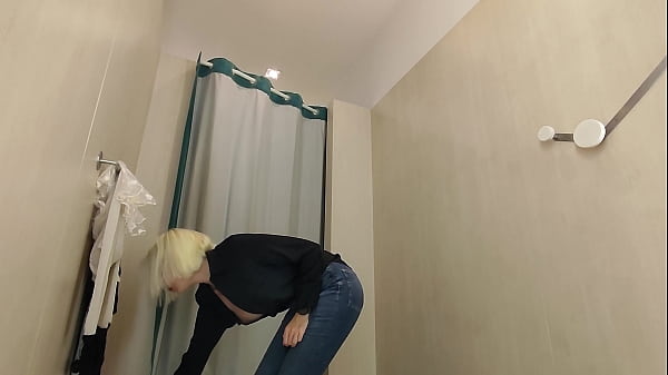 Image Hidden camera inside the public locker room, a naked girl trying on underwear. Spy in locker room