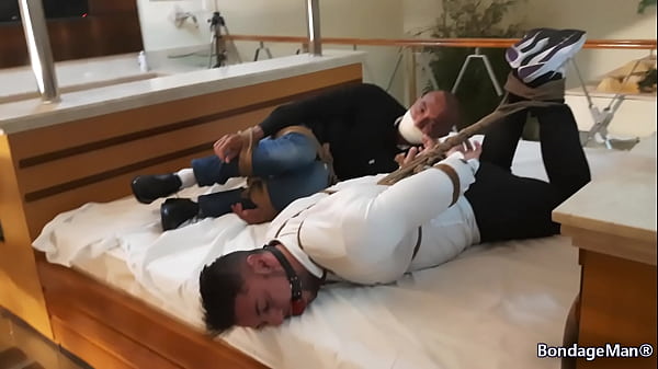 Image Peter and Victor tied up together on the bed ballgagged and gagged struggling | PREVIEW