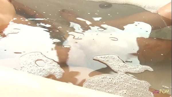 Image This beautiful Asian lesbian with pierced nipples and lush lips gets a royal sex treatment in a jacuzzi