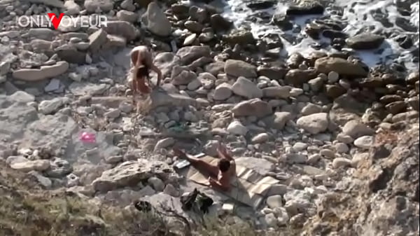 Image Beach Voyeur. Horny chick enjoys being fucked by stranger right on the beach