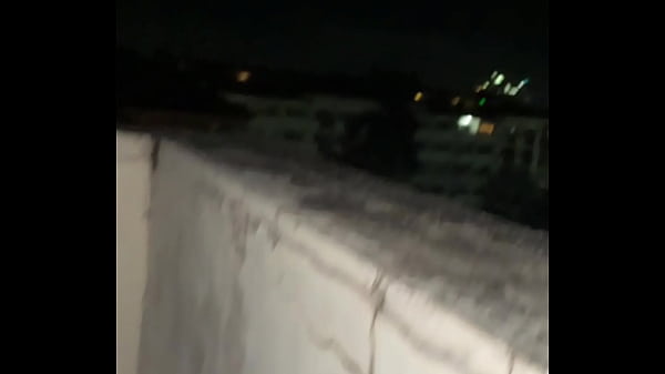Image Getting slutted out on top of a building outdoors