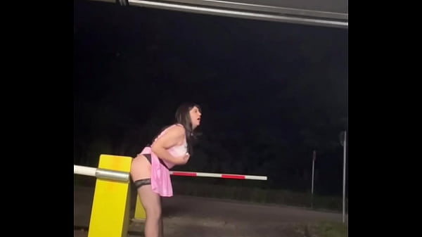 Image Sissy playing in public parking lot