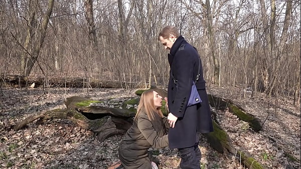 Image In the forest, a girl got on her knees and sucked a cock