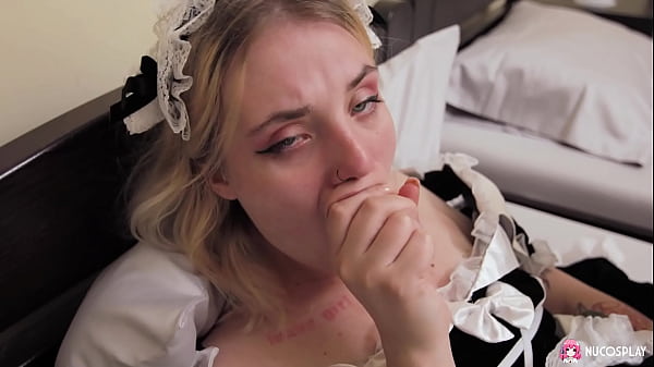 Image Horny blonde maid Angelina plays with a sex toy in a hotel room.