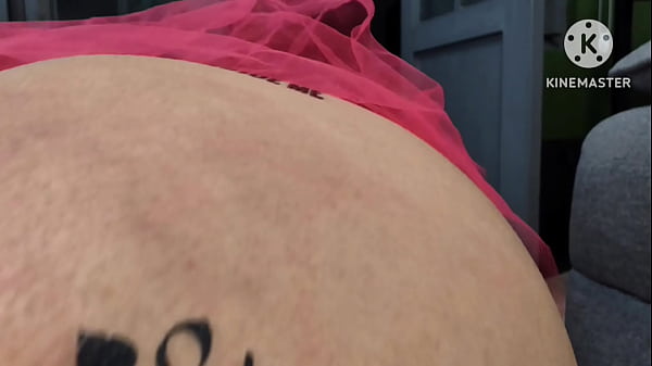Image Sissy in slutty pirate costume drinking 1l of via anal by the open door with people passing by