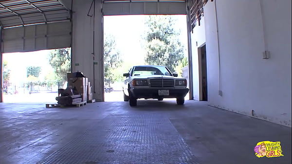 Image Car mechanic Kara Price flirts with the redheaded dyke Lily Cade before fingering her twat