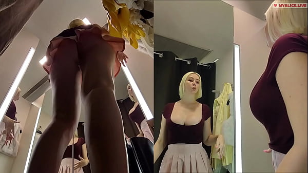Image Hidden camera in fitting room. Upskirt view on pussy and big tits