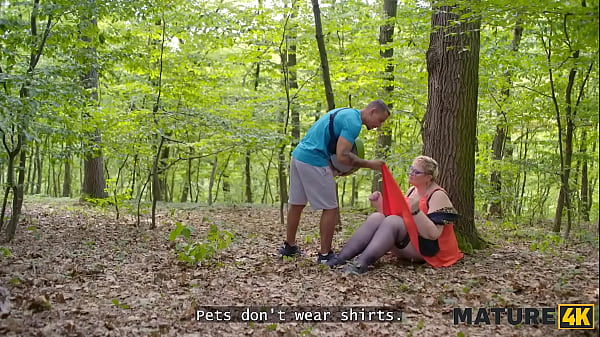 Image MATURE4K. Kinky mature giantess Diana loves pet play in stockings with 2 strangers in public