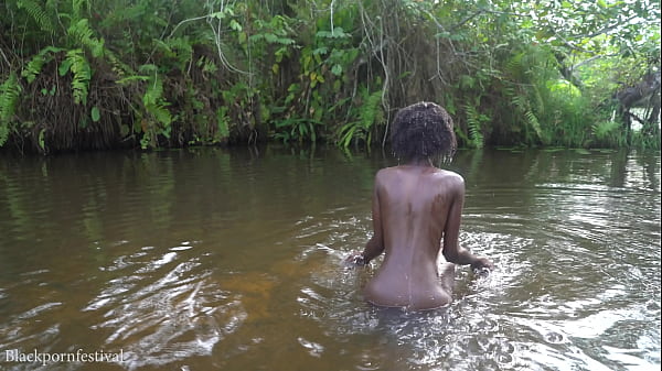 Image Attractive African village girl bathing in the river