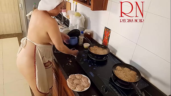 Image Nudist housewife Regina Noir cooks at the kitchen. Naked maid. Naked housewife. s3