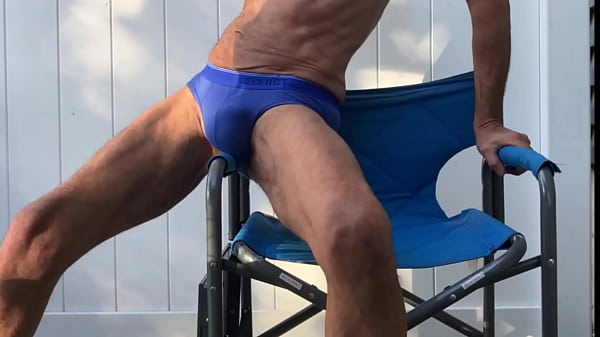 Image Deep Pelvic Stretching in Blue Briefs on Blue Chair Late October 2024