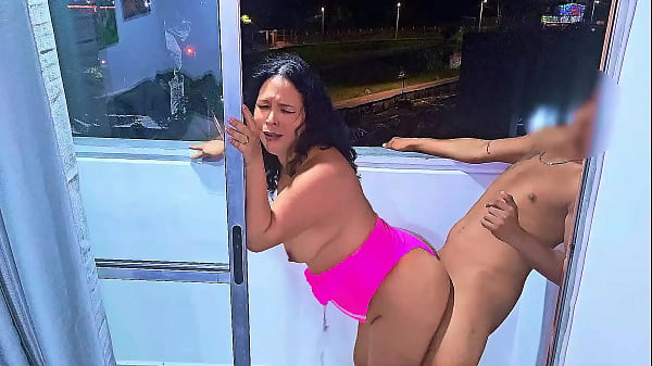 Image Latina slut fucking and sucking cock on a balcony overlooking the public street in Medellin, a wet blowjob and a frenetic fuck. While she is being fucked the cars pass by on the road. Venezuelan bitch
