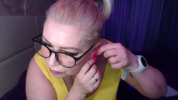 Image A cool busty vulgar mature whore in glasses with a ponytail on her head...