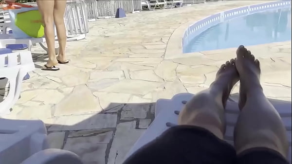 Image She noticed that I was jerking off and helped me cum right next to the public pool