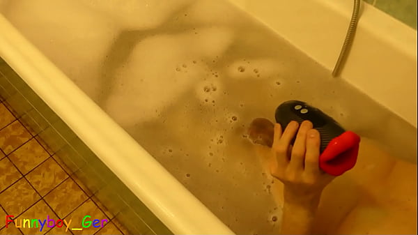 Image In the bathtub I tested an electric masturbator on my cock and squirted handsfree onto my stomach.