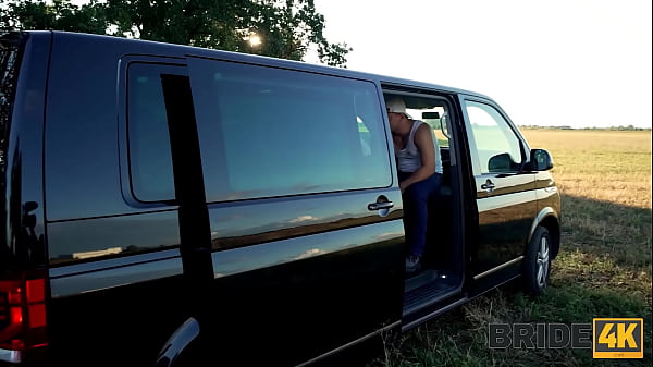 Image BRIDE4K. Horny bride ran away from the wedding and showed her natural tits to strangers in the field