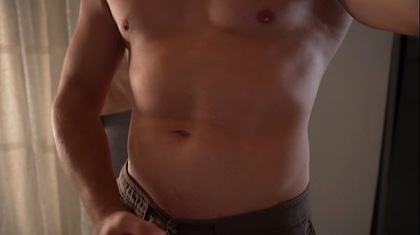 Image Strong guy posing at camera and cums on his belly