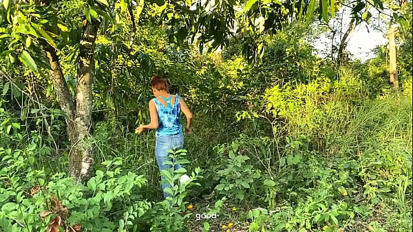 Image fund this girl looking for mangos in the woods