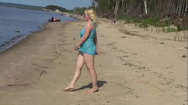 Image Milf teases pussy on the beach