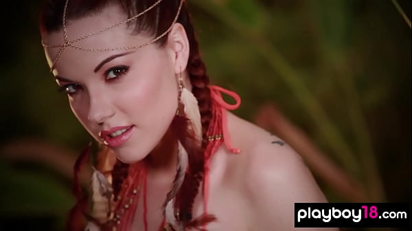 Image Inked teen Elizabeth Marxs showing her massive tits in a tropical forest