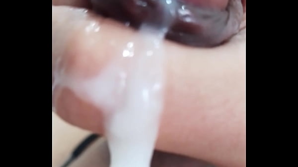 Image Leaking precum, cumming, jacking off my uncircumcised cock, extreme closeup. October 8, 2024.