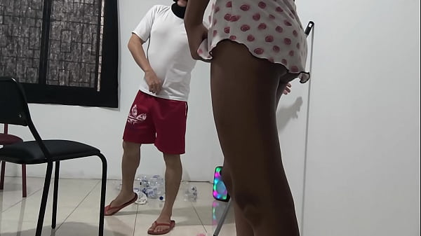 Image The cleaning worker seduces his boss during working hours. The man sensually touches his boss and sucks her tits