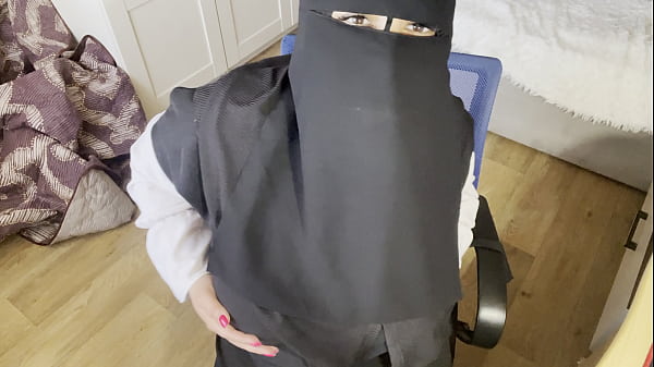 Image A Turkish woman with beautiful eyes in a hijab masturbates in pantyhose