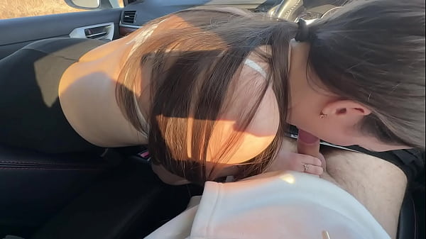 Image Girl friend fucked in the mouth of a car in a public parking lot