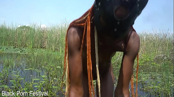 Image Slim African woman with a nice soft butt bathing in the river