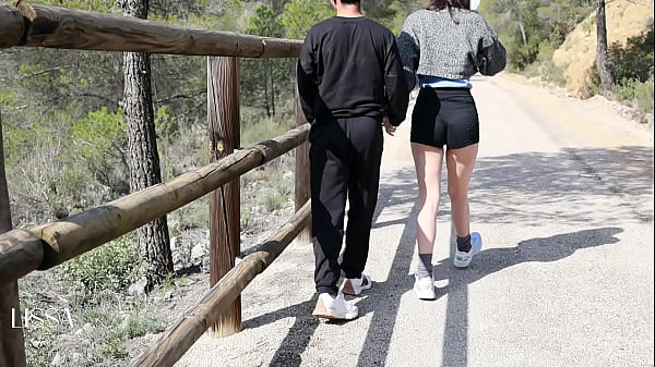Image Pissing on her and him outdoors with risky public sex