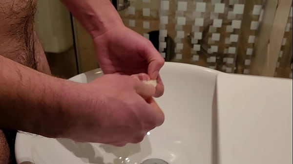Image Pissing inside a used condom