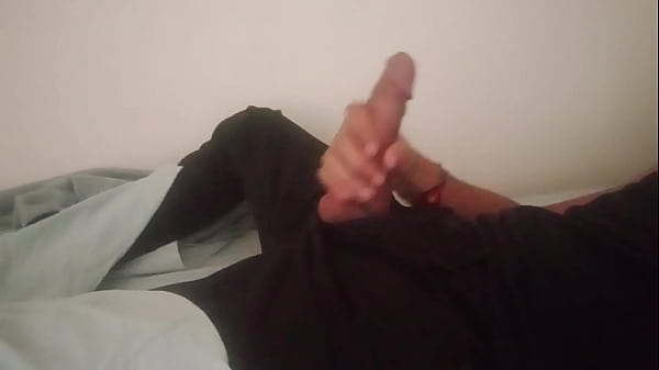 Image Horny guy in black pants moaning and jerking off his big cock after work until he cums