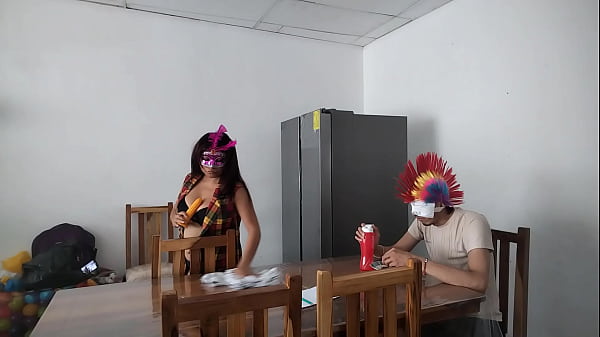 Image A housemaid touches her body very sensually and flirts with a dildo while feeding a blind man in the house.