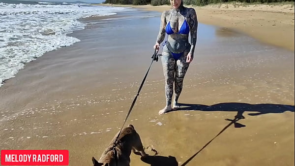 Image Bikini walking on a Public beach