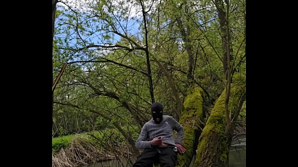 Image Outdoor wanking at the river, almost caught