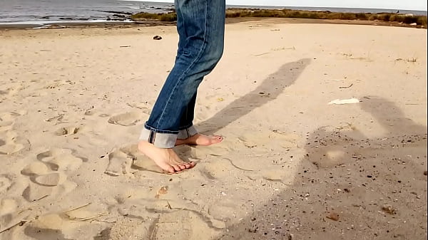 Image The busty, big-assed brunette is walking along the beach. I tell her I'm wearing women's underwear.