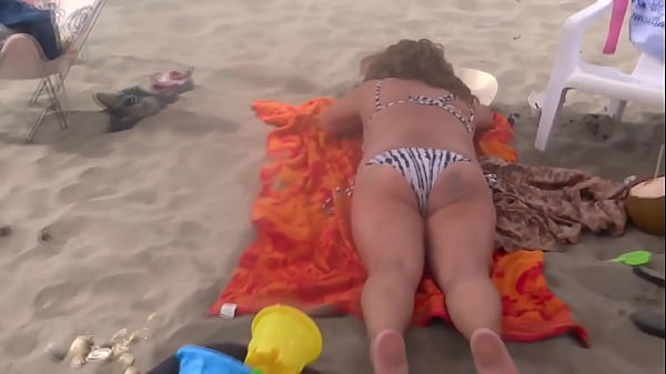 Image Stepmom shows off on the beach, very excited, and masturbates