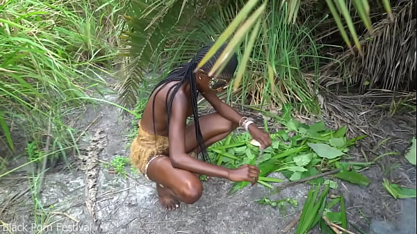Image Hot African native woman cooking in the jungle