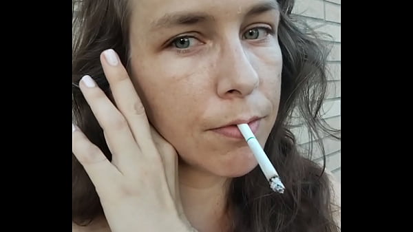 Image Kelly Kendricks smokes cigarettes in the sun with lots of cleavage