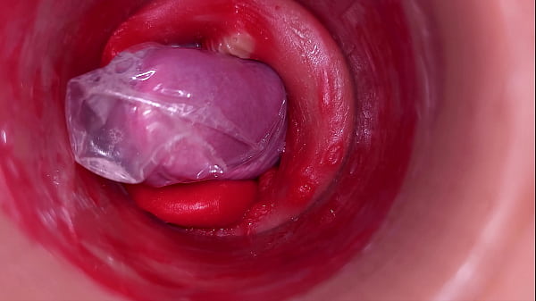 Image The camera inside the deep pussy records a huge ejaculation with a stuck condom