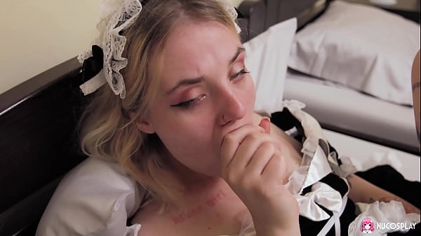 Image Horny tattooed maid Angelina plays in bed with a sex toy.