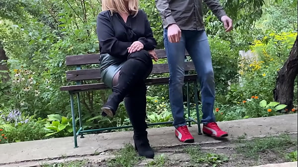 Image Mature milf in sexy clothes helps a man pee outdoors