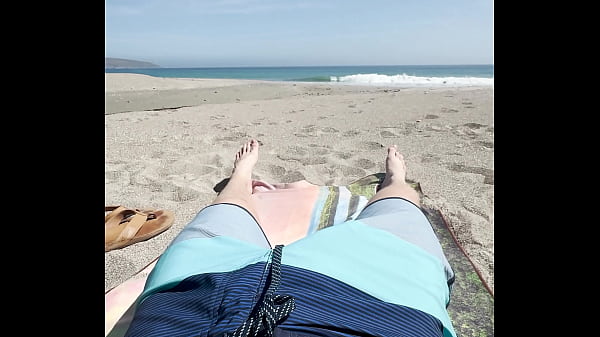 Image Teen jerks off on public beach