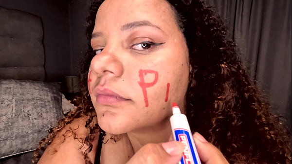 Image BBW colored girl DEEPTHROATING A dildo after writing dirty words on her whore face