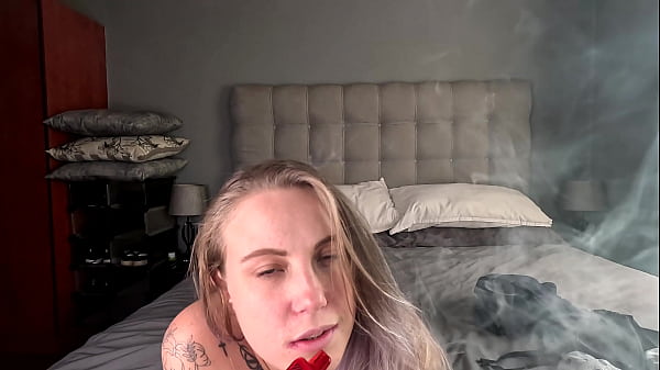 Image Tattooed blonde taking off her clothes smokes her vape naked