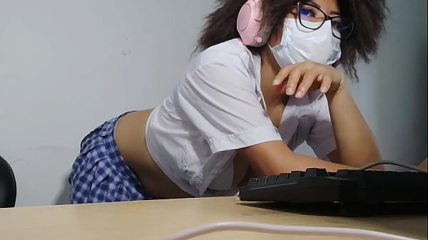 Image Beautiful student is getting excited while singing while doing homework
