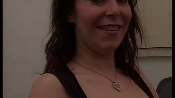 Image THIS MILF WITH A SLUTTY LOOK AND A DESIRE FOR COCK TAKES IT WITH PLEASURE
