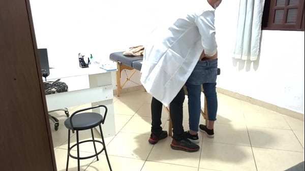Image Proctologist performs anal exam on constipated patient.