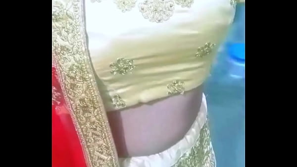 Image Indian Gay Crossdresser Bottom Gaurisisy feeling horny and pressing and playing with her big boobs in golden lehanga
