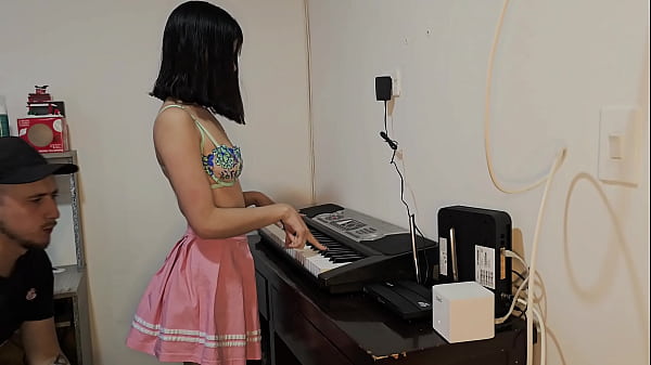 Image Sexy and hot Laura in skirt wants to learn to play the piano.